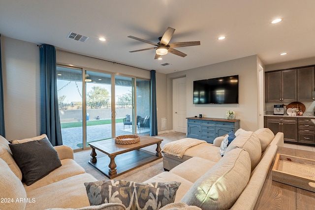 living room featuring ceiling fan