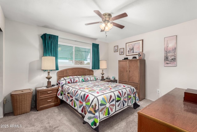 bedroom with light colored carpet and ceiling fan