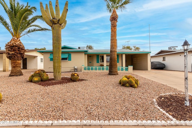 ranch-style house with a carport