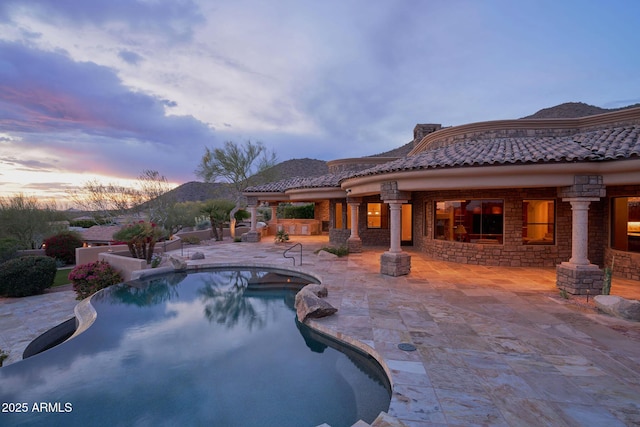 pool with a patio