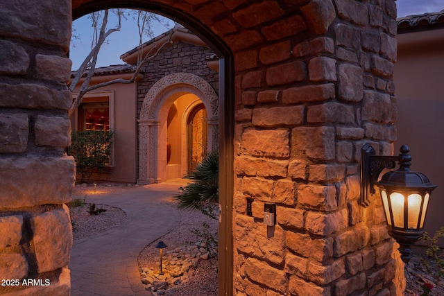 property entrance with a tile roof