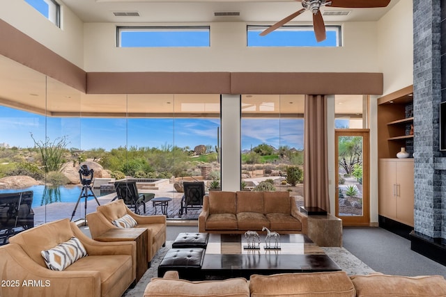 10267 E Cinder Cone Trl, Scottsdale, AZ 85262 - carpeted living area with a towering ceiling and ceiling fan