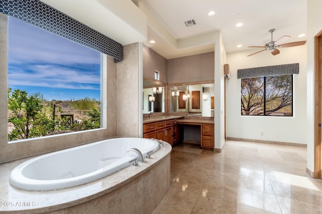 10267 E Cinder Cone Trl, Scottsdale, AZ 85262 - bathroom with vanity, a garden tub, baseboards, recessed lighting, and ceiling fan