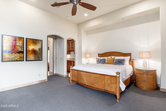 10267 E Cinder Cone Trl, Scottsdale, AZ 85262 - bedroom featuring dark colored carpet, arched walkways, recessed lighting, baseboards, and a ceiling fan