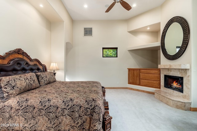 10267 E Cinder Cone Trl, Scottsdale, AZ 85262 - carpeted bedroom featuring a high end fireplace, baseboards, recessed lighting, and ceiling fan