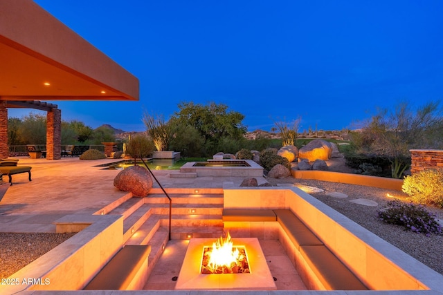 10267 E Cinder Cone Trl, Scottsdale, AZ 85262 - view of patio featuring an outdoor fire pit