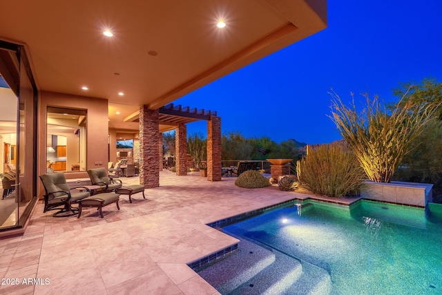 10267 E Cinder Cone Trl, Scottsdale, AZ 85262 - pool at night with a patio and an outdoor hangout area