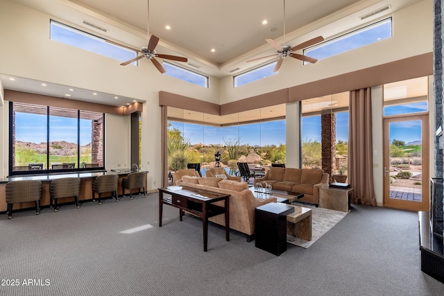 10267 E Cinder Cone Trl, Scottsdale, AZ 85262 - living room with carpet flooring, healthy amount of natural light, recessed lighting, a ceiling fan, and a towering ceiling