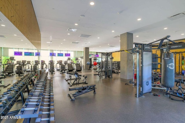 workout area with floor to ceiling windows and visible vents