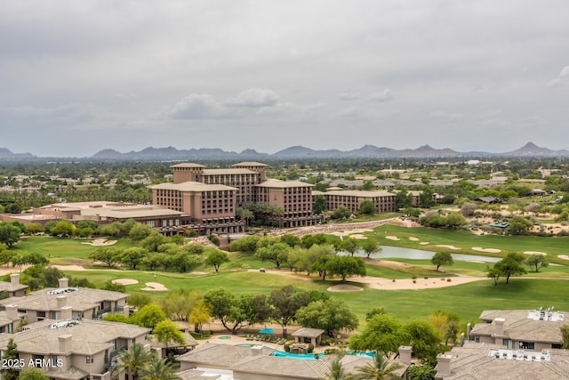 birds eye view of property with a mountain view and golf course view