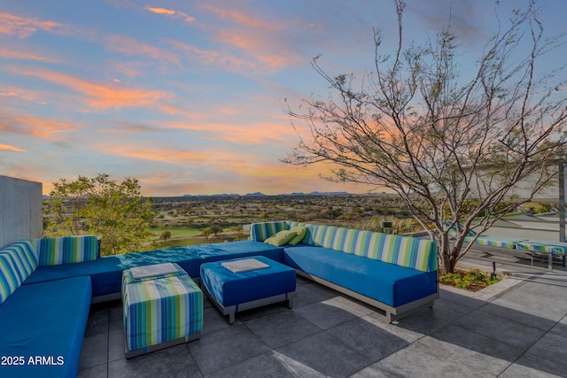 patio terrace at dusk with an outdoor living space