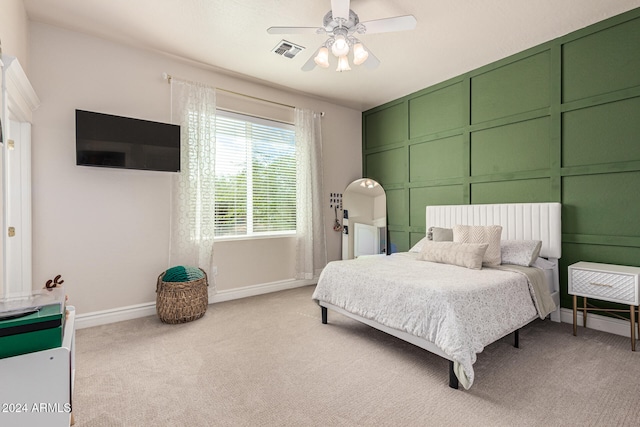 carpeted bedroom with ceiling fan