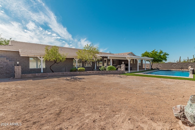 back of property with a patio