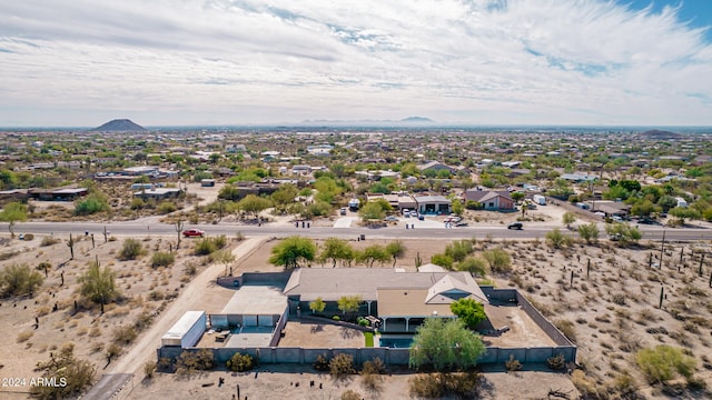 birds eye view of property with a mountain view