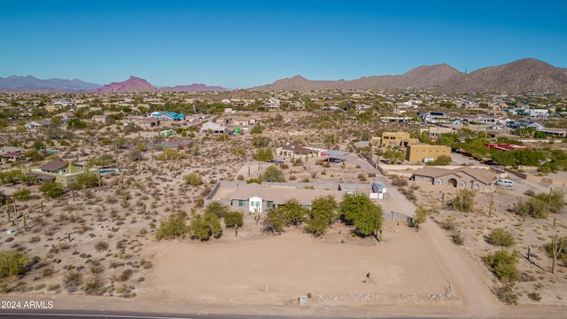 birds eye view of property featuring a mountain view