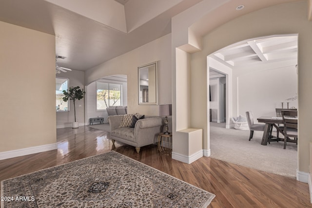 interior space featuring hardwood / wood-style flooring, beamed ceiling, and coffered ceiling