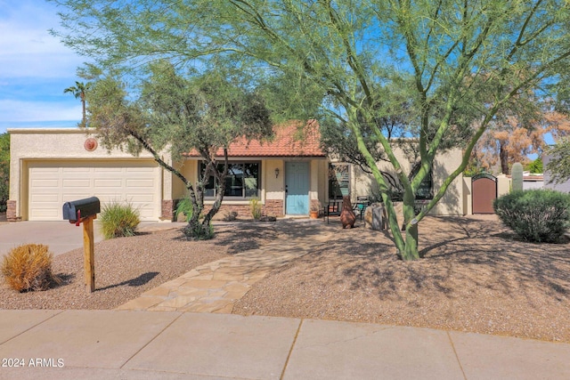 ranch-style home featuring a garage