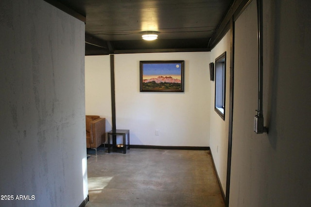 hall with concrete flooring