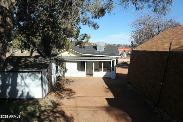 view of side of home with a sunroom