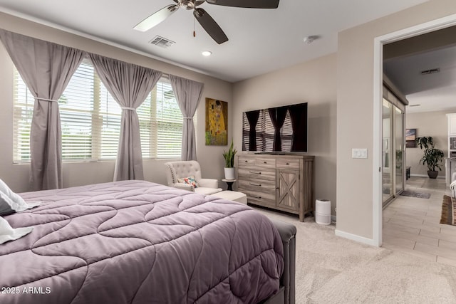 2229 N 139th Dr, Goodyear, AZ 85395 - bedroom featuring light colored carpet, baseboards, visible vents, and ceiling fan