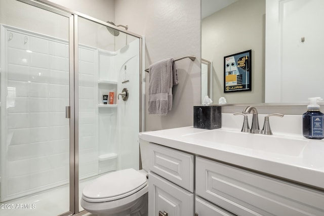 2229 N 139th Dr, Goodyear, AZ 85395 - bathroom featuring vanity, toilet, and a stall shower