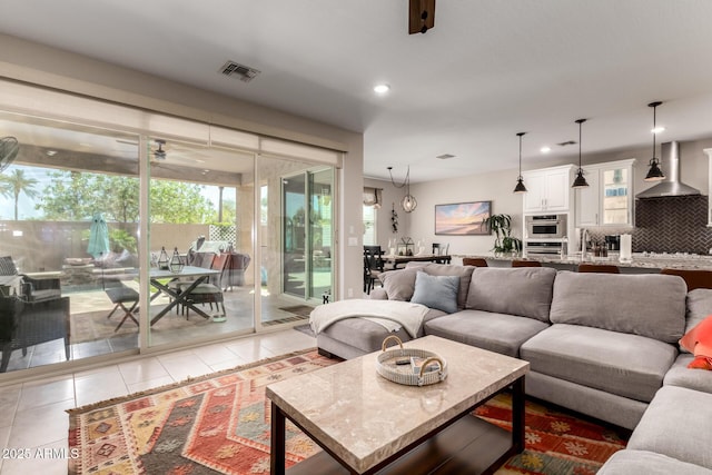 2229 N 139th Dr, Goodyear, AZ 85395 - tiled living room featuring a ceiling fan, recessed lighting, and visible vents