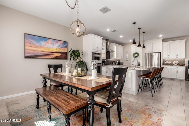 2229 N 139th Dr, Goodyear, AZ 85395 - dining room with light tile patterned floors, baseboards, recessed lighting, and visible vents