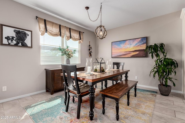 2229 N 139th Dr, Goodyear, AZ 85395 - dining space featuring baseboards and light tile patterned floors