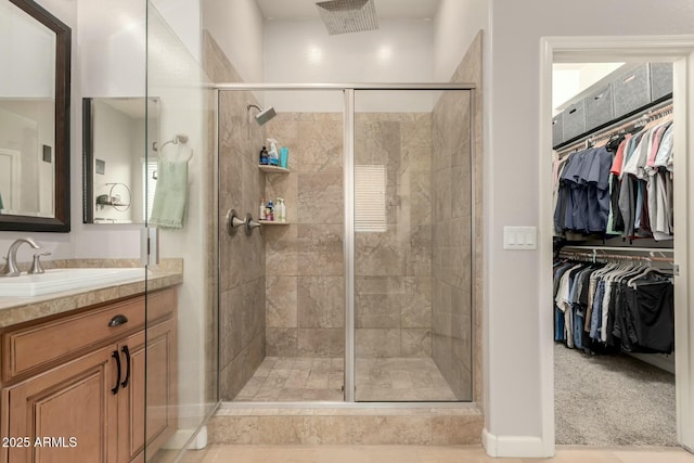 bathroom with an enclosed shower and vanity