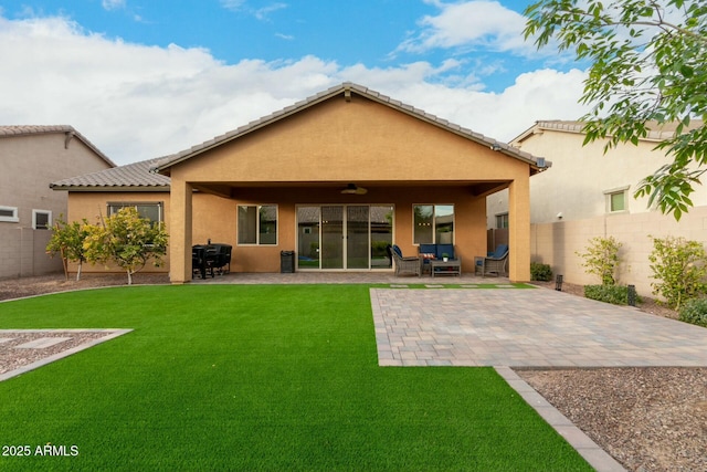 back of house with an outdoor living space, a patio, and a lawn