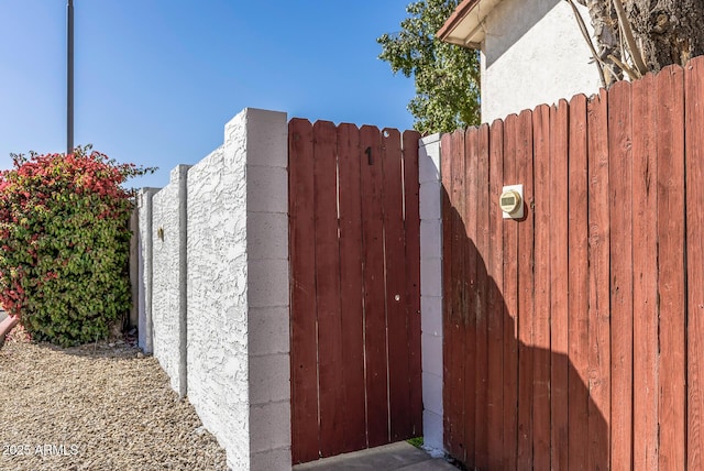 view of gate featuring fence