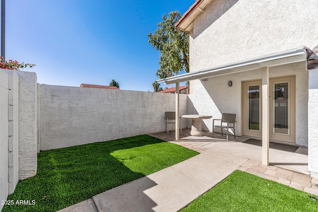 view of yard with a fenced backyard and a patio area