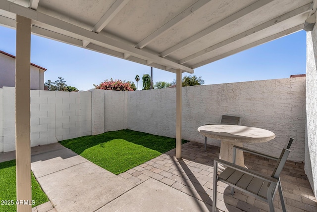 view of patio / terrace featuring a fenced backyard and outdoor dining space