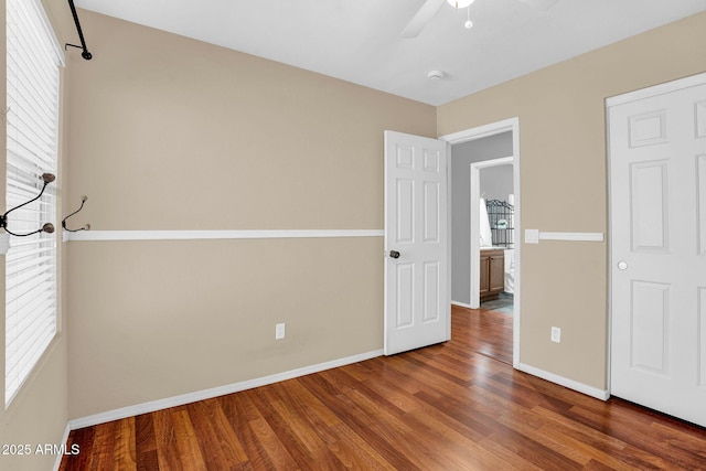 1314 S Bridgegate Dr, Gilbert, AZ 85296 - unfurnished bedroom featuring wood finished floors, baseboards, and a ceiling fan