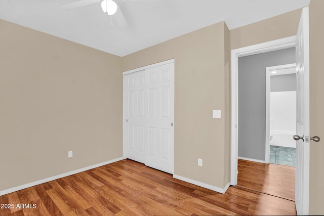 1314 S Bridgegate Dr, Gilbert, AZ 85296 - unfurnished bedroom with light wood finished floors, baseboards, a closet, and ceiling fan