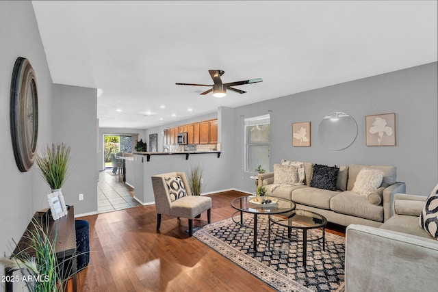 1314 S Bridgegate Dr, Gilbert, AZ 85296 - living room featuring a ceiling fan, wood finished floors, recessed lighting, and baseboards
