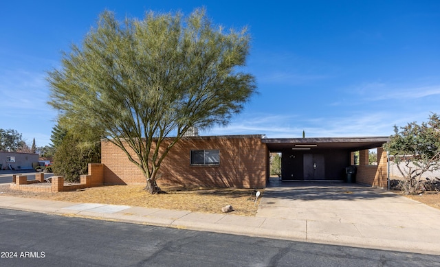 view of front of property with a carport