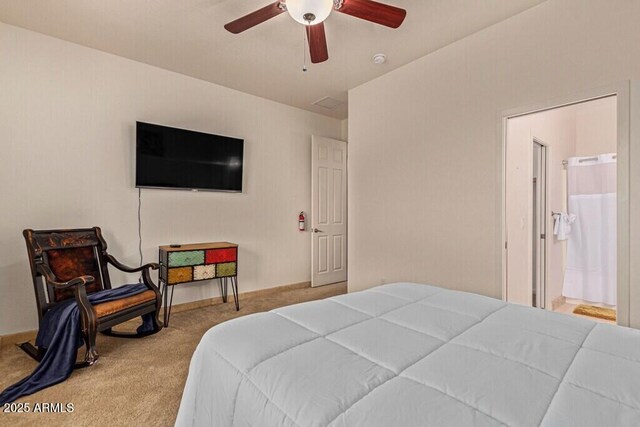 bedroom with carpet, ensuite bathroom, baseboards, and a ceiling fan