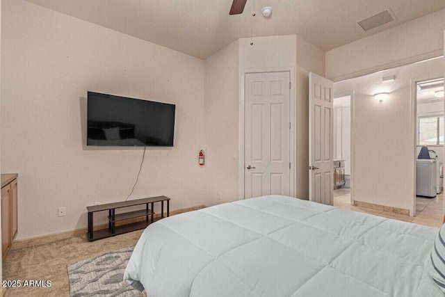 bedroom with ceiling fan, ensuite bathroom, baseboards, and visible vents
