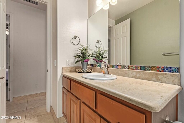 bathroom with vanity, visible vents, and tile patterned floors