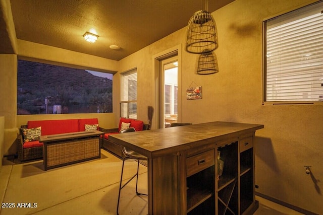 exterior space featuring a textured ceiling