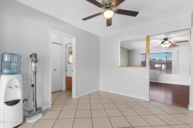 1604 W Kerry Ln, Phoenix, AZ 85027 - empty room featuring light tile patterned floors, baseboards, a textured ceiling, and a ceiling fan