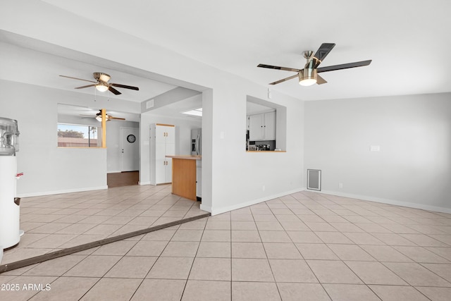 1604 W Kerry Ln, Phoenix, AZ 85027 - unfurnished living room featuring light tile patterned floors, baseboards, and a ceiling fan