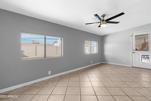 1604 W Kerry Ln, Phoenix, AZ 85027 - unfurnished room featuring light tile patterned floors, baseboards, ceiling fan, and vaulted ceiling