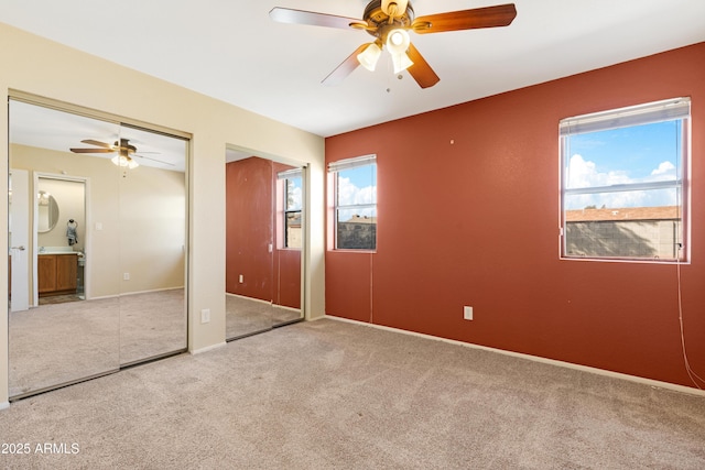 1604 W Kerry Ln, Phoenix, AZ 85027 - unfurnished bedroom with two closets, a ceiling fan, baseboards, and carpet floors