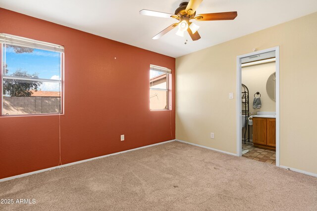1604 W Kerry Ln, Phoenix, AZ 85027 - unfurnished bedroom with multiple windows, baseboards, and light carpet