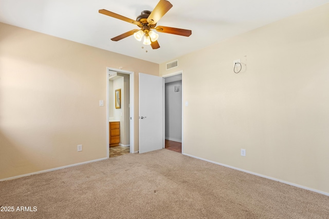 1604 W Kerry Ln, Phoenix, AZ 85027 - unfurnished bedroom with carpet, visible vents, baseboards, ceiling fan, and ensuite bathroom