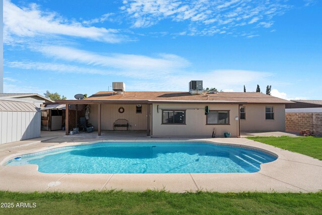1604 W Kerry Ln, Phoenix, AZ 85027 - rear view of property with cooling unit, a storage shed, an outbuilding, an outdoor pool, and a patio