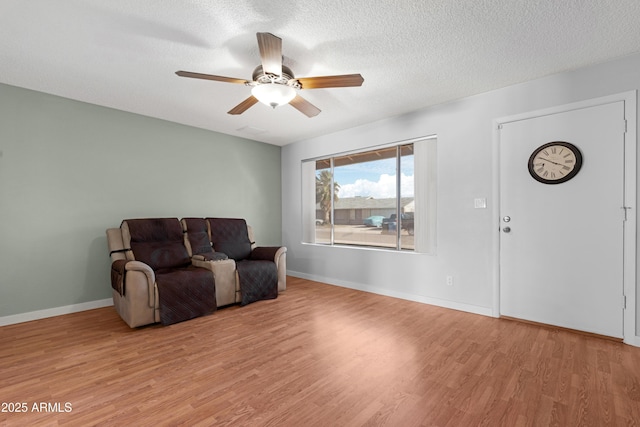 1604 W Kerry Ln, Phoenix, AZ 85027 - sitting room with baseboards, a textured ceiling, ceiling fan, and light wood finished floors