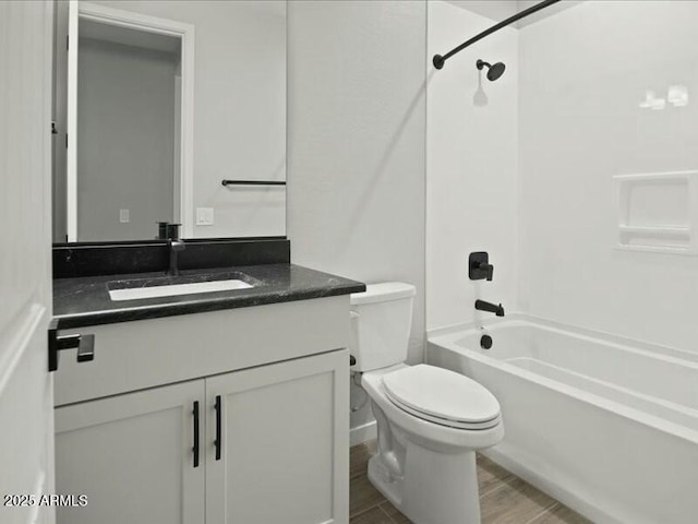 full bathroom featuring vanity, toilet, and shower / bathtub combination